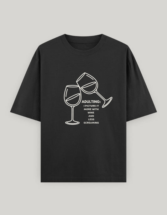 Black t-shirt with wine glass graphic and text on a gray background