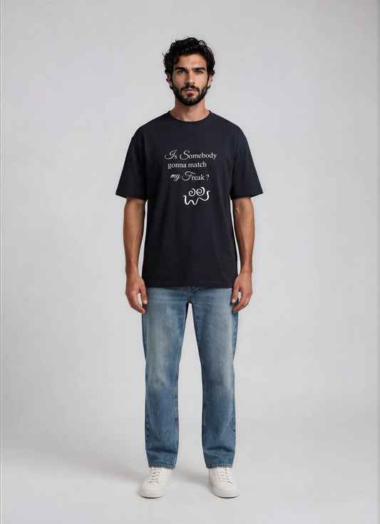 Man wearing navy blue t-shirt with text design