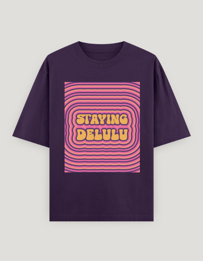Purple t-shirt with pink and yellow graphic design on a gray background